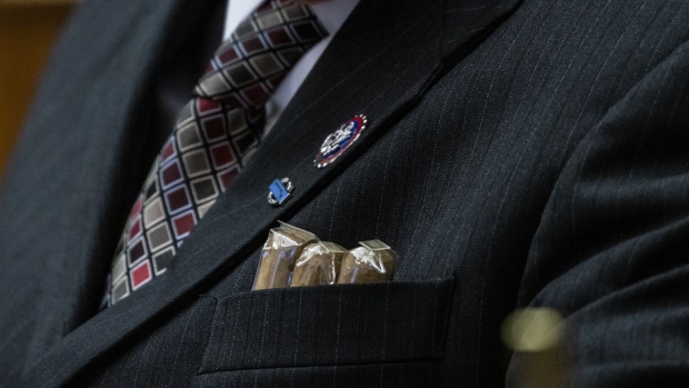 Cigars poke out of Troy Nehls’s jacket pocket during a hearing in Washington DC. 