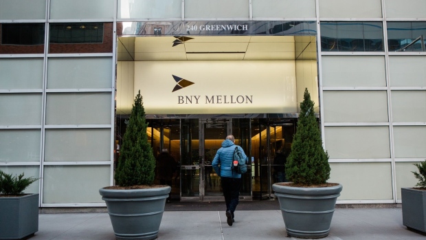 A pedestrian enters a Bank of New York Mellon Corp. office building in New York, U.S., on Monday, Jan. 13, 2020. BNY Mellon is scheduled to release earnings figures on January 16.