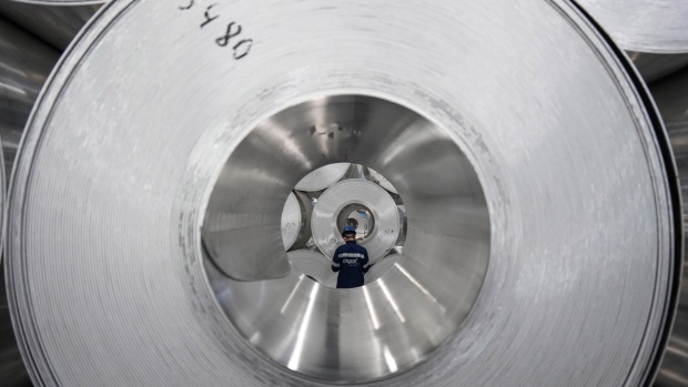 A worker checks the inventory of rolls of sheet aluminum at the Impol Seval AD Sevojno plant in Sevojno, Serbia, on Thursday, March 17, 2022. The cooling of metal markets contrasts with the sharp moves higher earlier this month, when both copper and aluminum touched new records.