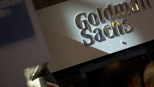 <p>The Goldman Sachs & Co. logo is displayed at the company's booth on the floor of the New York Stock Exchange.</p>