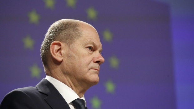 Olaf Scholz, Germany's chancellor, at a news conference at the European Union (EU) headquarters in Brussels, Belgium, on Friday, Dec. 10, 2021. Scholz said a Russian invasion of Ukraine would trigger reprisals, the latest warning to President Vladimir Putin from Western leaders, though he declined to specify if halting the Nord Stream 2 gas pipeline would be part of any response.