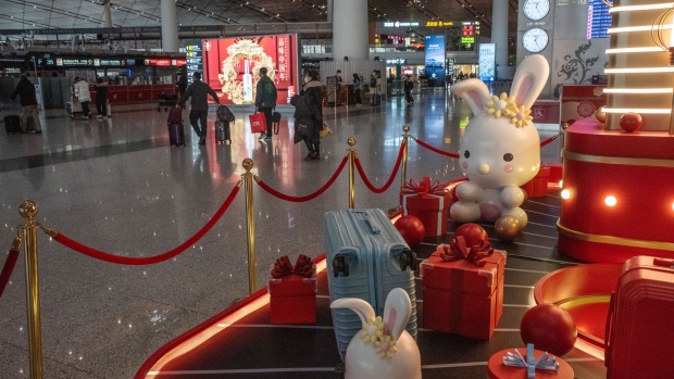 An installation for Lunar New Year at Beijing Capital International Airport in Beijing, China, on Saturday, Jan. 14, 2023. There are growing concerns that this month’s Lunar New Year holiday will see Covid sweep through smaller cities and rural areas as hundreds of thousands of people travel home, with many finally able to reunite with family after three years.