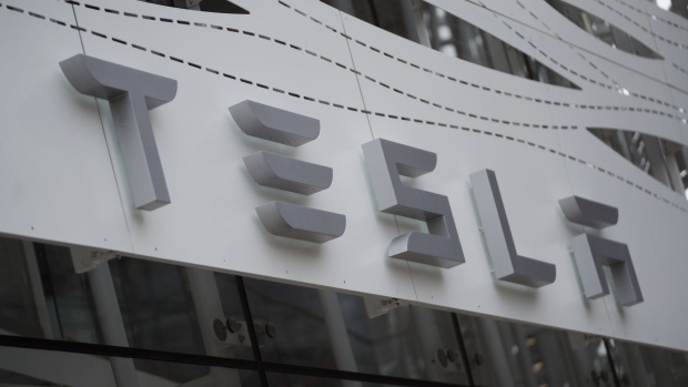 A Tesla showroom in Santa Monica, California, US, on Friday, Jan. 13, 2023. Tesla Inc. cut prices across its lineup in the US and major European markets in the carmakers latest effort to stoke demand after several quarters of disappointing deliveries.