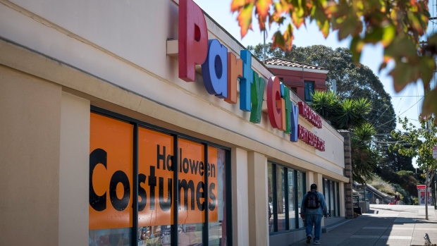 A pedestrian walks past a Party City store in San Francisco, California, U.S., on Wednesday, Sept. 22, 2020. Halloween is a key holiday for Party City, but with Americans wearing different kinds of masks and keeping their distance, its scary season could extend well beyond the end of the October. Photographer: David Paul Morris/Bloomberg
