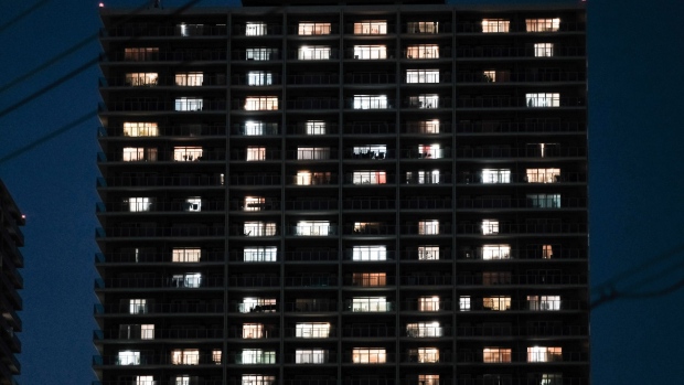 A residential building at night in Yao, Osaka Prefecture, Japan, on Tuesday, June 28, 2022. Japan’s government gave warning about a power crunch urging residents to reduce electricity consumption as the unusual heat threatens to sap electricity supply.