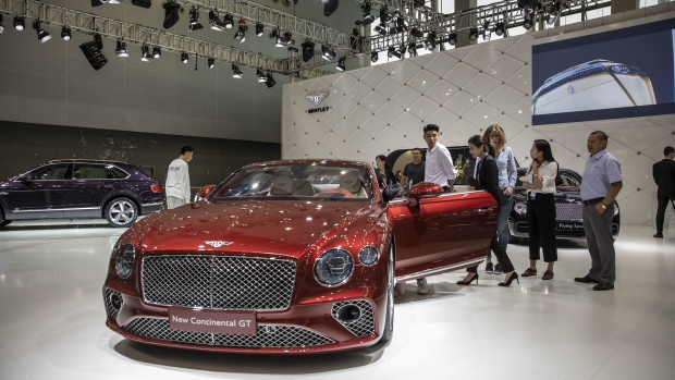 Bentley Motors Ltd.'s New Continental GT vehicle is displayed at the Guangzhou International Automobile Exhibition in Guangzhou, China, on Friday, Nov. 16, 2018. More than 60 new models are being unveiled at the auto show in the southern city of�Guangzhou�starting Friday, with manufacturers betting on swanky SUVs and electric cars to revive a market headed for its first annual�slump�in at least two decades.