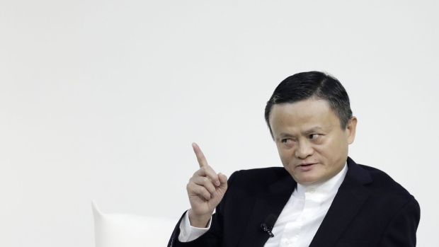Jack Ma, former chairman of Alibaba Group Holding Ltd., gestures while speaking during a dialog session with Masayoshi Son, chairman and chief executive officer of SoftBank Group Corp., not pictured, at Tokyo Forum 2019 in Tokyo, Japan, on Friday, Dec. 6, 2019. Son unveiled a $184 million initiative Friday to accelerate artificial intelligence research in Japan, enlisting Ma to expound on his goal of commercializing the technology. Son's company announced a partnership with the University of Tokyo that includes spending 20 billion yen ($184 million) over 10 years by mobile arm SoftBank Corp. to establish the Beyond AI Institute.