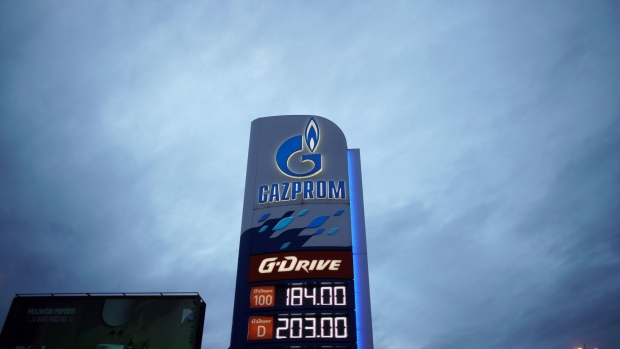 Fuel prices listed on a totem sign at a Gazprom PJSC gas station. Photographer: Oliver Bunic/Bloomberg
