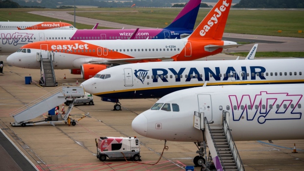 Passenger aircraft, operated by EasyJet Plc, Wizz Air Holdings Plc and Ryanair Holdings Plc, on the tarmac at London Luton Airport Ltd. in Luton, U.K., on Thursday, Sept. 9, 2021. EasyJet rejected an unsolicited takeover approach from rival discounter Wizz Air, according to people familiar with the matter, and said it will raise $2 billion in stock and debt instead.