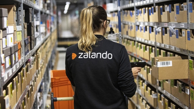 An order picker scans barcodes while collecting customer delivery orders inside the Zalando SE online shopping logistics and fulfillment center in Erfurt, Germany, on Thursday, Aug. 15, 2019. Buying clothing online is popular in Europe's largest economy, but it's also the category that gets returned the most because many shoppers buy more than they need to try on different garments in the comfort of their own home.