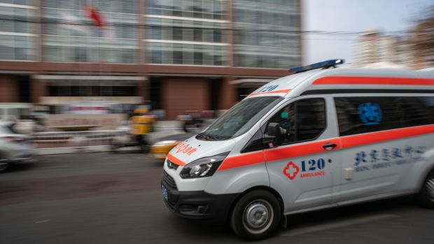 An ambulance passes a hospital in Beijing, China, on Thursday, Jan. 19, 2023. Chinese leader Xi Jinping called for greater efforts to fight Covid in a pre-holiday video call with people in rural areas, breaking with precedent by holding the event virtually instead of making an in-person visit.