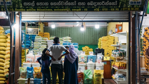 Shoppers at a grains stall at the Narahenpita Economic Centre in Colombo, Sri Lanka, on Sunday, May 22, 2022. Sri Lanka’s dollar bonds due July rebound after Friday’s drop, up almost 5 cents on the dollar in the biggest gain since October, as the government holds bailout talks with the IMF. Photographer: Jonathan Wijayaratne/Bloomberg