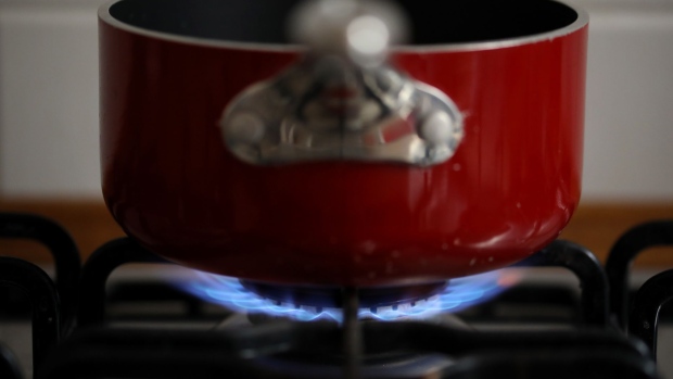 Natural gas burns on a domestic kitchen stove in Rome, Italy, on Wednesday, Dec. 29, 2021. European gas prices declined to near the lowest level in three weeks, with increased inflows at terminals in the region bringing relief to the tight market.