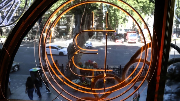 A bitcoin logo in the window of the Conexus Crypto currency exchange office in Tbilisi, Georgia, on Monday, July 25, 2022. A buzz is building in crypto-investor circles and on Twitter about Bitcoin’s stealth July rally, which has beleaguered investors starting to ponder whether the largest digital asset has found a bottom. Photographer: Valeria Mongelli/Bloomberg
