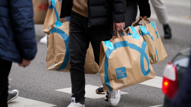 A shopper carries Primark branded bags in central Madrid, Spain, on Thursday, Dec. 29, 2022. The euro area faces a “very difficult economic situation” that will test individuals and businesses, European Central Bank Vice President Luis de Guindos said.