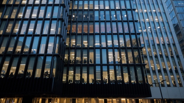Office windows sit illuminated in London, U.K., on Thursday, Nov. 22, 2018. Brexit Britain will be the top destination for major European investors to snap up commercial property next year, according to a survey of executives managing more than 500 billion pounds ($640 billion) of real estate conducted by Knight Frank. Photographer: Chris Ratcliffe/Bloomberg