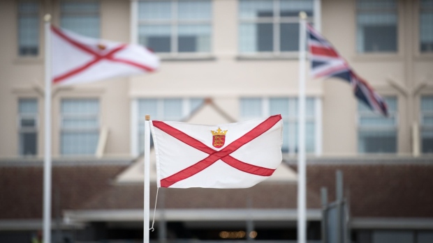 ST HELIER, JERSEY - APRIL 12: The Jersey flag flutters in the wind in St Helier on April 12, 2017 in St Helier, Jersey. Jersey, which is not a member of the European Union, is one of the top worldwide offshore financial centres, described by some as a tax haven, as it attracts deposits from customers outside of the island who seek the advantages of reduced tax burdens. In 2008 Jersey's gross national income per capita was among the highest in the world. However, its taxation laws have been widely criticised by various people and groups including the EU. As the UK negotiates its exit from the EU having triggered Article 50, concerns have been raised as to how this will affect the future of the financial industry on the island especially as The chancellor, Philip Hammond has claimed Britain could also become a corporate tax haven if the EU fails to provide it with an agreement on financial market access after Brexit. (Photo by Matt Cardy/Getty Images)