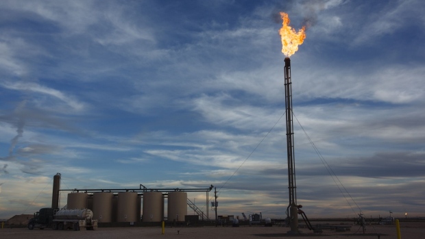 A gas flare burns at a Matador Resources Co. site in Loving County, Texas. Photographer: Angus Mordant/Bloomberg
