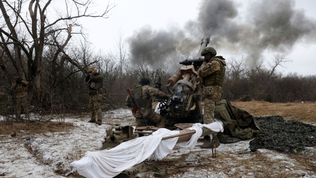 Ukrainian artillerymen fire an L119 howitzer towards Russian positions at a front line in the Lugansk region on January 16. Photographer: Anatolii Stepanov/AFP/Getty Images