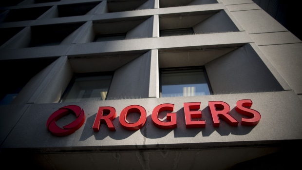 Rogers Communications Inc. signage is displayed on the exterior of a building in Toronto, Ontario, Canada, on Wednesday, May 17, 2017. Rogers Communications, Canada's largest wireless carrier, is leveraging organic growth in the country's wireless market to expand its subscriber base. Photographer: Brent Lewin/Bloomberg