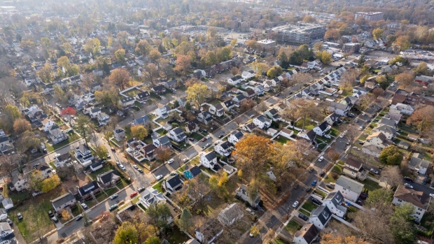 Residential homes in Teaneck, New Jersey, US, on Thursday, Nov. 24, 2022. Real estate agents struggle to find listings as deals decline, mortgage rates remain high and signs point to leaner times ahead. Photographer: Yuvraj Khanna/Bloomberg