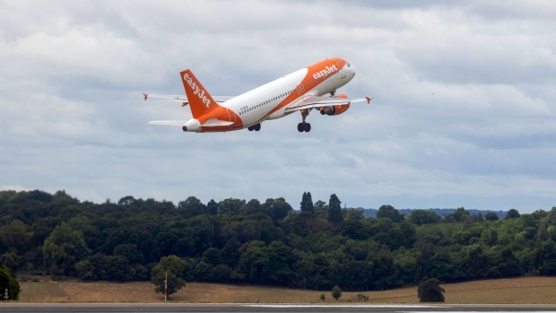 A passenger aircraft, operated by EasyJet Plc, taking off at London Luton Airport in Luton, U.K., on Monday, July 25, 2022. EasyJet are due to report their latest earnings on Tuesday.