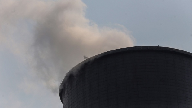 Steam billows from a cooling tower at the coal-fired NTPC Simhadri thermal power plant in the outskirts of Visakhapatnam, Andhra Pradesh, India, on Sunday, March 20, 2022. India, the world’s third biggest emitter of greenhouse gases, plans to more than triple its clean-energy capacity by the end of the decade and zero out emissions by 2070. Photographer: Dhiraj Singh/Bloomberg