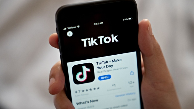 ByteDance Ltd.'s TikTok app is displayed in the App Store on a smartphone in an arranged photograph taken in Arlington, Virginia, U.S., on Monday, Aug. 3, 2020. In a bid to salvage a deal for the U.S. operations of TikTok, Microsoft Corp. Chief Executive Officer Satya Nadella spoke with President Donald Trump by phone about how to secure the administrations blessing to buy the wildly popular, but besieged, music video app.