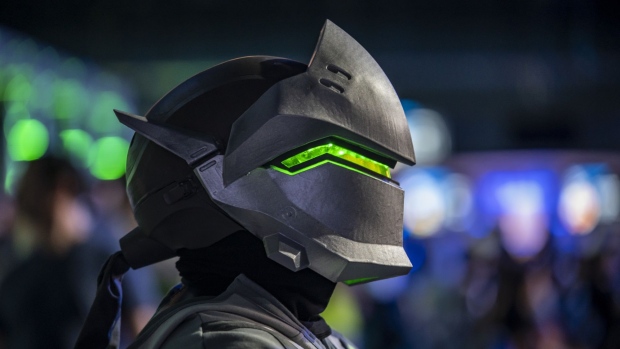 An attendee dressed as the character Genji from Overwatch during the Activision Blizzard Inc. Overwatch League 'Battle For Texas' tournament at Tech Port Arena in San Antonio, Texas, U.S., on Friday, May 6, 2022. The 'Battle For Texas' tournament is the first in-person match since early 2020. Photographer: Sergio Flores/Bloomberg