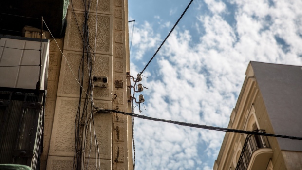 Electricity cables outside a residential apartment in the Barceloneta neighborhood of Barcelona, Spain, on Thursday, July 29, 2021. Scorching heat is boosting electricity prices across Europe, adding to a long list of factors that have sent power costs surging this summer.