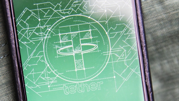 The Tether logo is seen on a smartphone in this arranged photograph taken in Washington, D.C., U.S., on Tuesday, Dec. 5, 2017. Tether, which started trading in 2015, is described as a stable alternative to bitcoin's wild price swings.