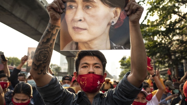 A demonstrator holds up an image of Aung San Suu Kyi during a protest outside the Embassy of Myanmar in Bangkok, Thailand, on Monday, Feb. 1 2021. Myanmar's military detained Suu Kyi, declared a state of emergency and seized power for a year after disputing her party’s landslide November election victory in a setback for the country's nascent transition to democracy. Photographer: Andre Malerba/Bloomberg