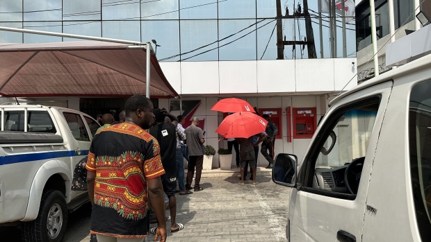 People queue at a Zenith Bank branch ATM to withdraw new naira banknotes, in Lagos, on Jan. 27. Photographer: Anthony Osae-Brown/Bloomberg
