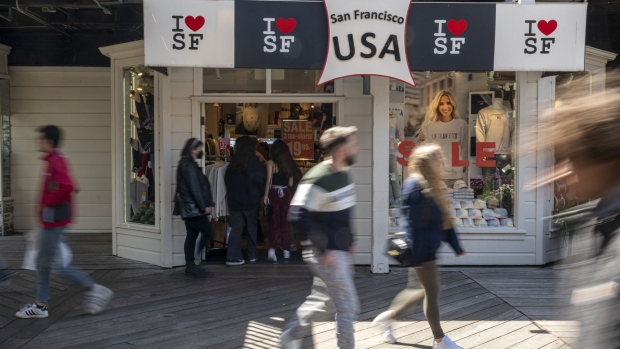 Tourists walk on Pier 39 in San Francisco, California, U.S., on Tuesday, April, 12, 2022. San Francisco's beleaguered tourism industry got good news when hotels hit their highest occupancy rate - 76% - since before the pandemic, last month, reported the San Francisco Chronicle.