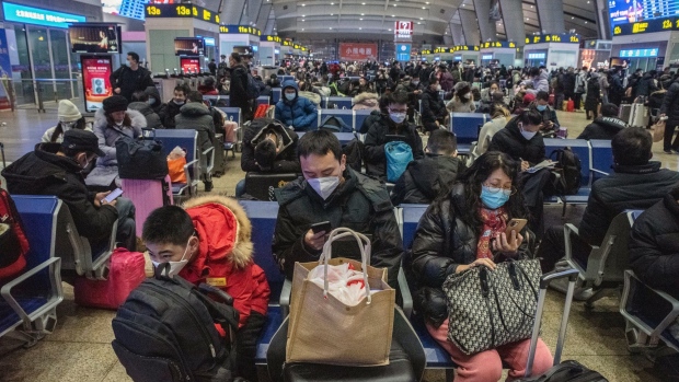 Travelers at Beijing South Railway Station in Beijing, China, on Sunday, Jan. 15, 2023. There are growing concerns that this month’s Lunar New Year holiday will see the virus sweep through smaller cities and rural areas as hundreds of thousands of people travel home, with many finally able to reunite with family after three years.