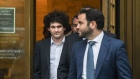 Sam Bankman-Fried, co-founder of FTX Cryptocurrency Derivatives Exchange, left, departs from court in New York, US, on Tuesday, Jan. 3, 2023. Bankman-Fried pleaded not guilty to criminal charges Tuesday and is set to face a trial in October, a courtroom showdown likely to be one of the highest-profile white-collar fraud cases in recent years. Photographer: Stephanie Keith/Bloomberg