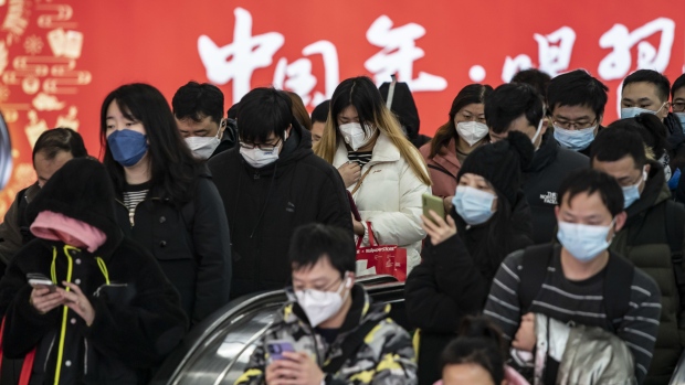 Commuters at a subway station in Shanghai, China, on Tuesday, Jan. 3, 2023. China's economy ended the year in a major slump as business and consumer spending plunged in December, with more disruption likely in the first few months of the year as Covid infections surge across the country. Photographer: Qilai Shen/Bloomberg