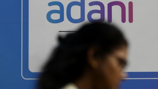 Signage of Adani Group in Mumbai, India, on Friday, Jan. 27, 2023. Shares of Adani Group’s companies have lost more than $30 billion in market value in less than two sessions, as a selloff sparked by US short seller Hindenburg Research’s scathing report deepened on Friday. Photographer: Indranil Aditya/Bloomberg