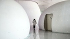 An employee walks past 'space capsules', resting and recreation area for staff, at the Baidu Inc. headquarters in Beijing, China, on Thursday, March 4, 2021. Chinese search engine giant Baidu has secured approval from the Hong Kong stock exchange for a second listing in the city, according to people familiar with the matter. Photographer: Qilai Shen/Bloomberg