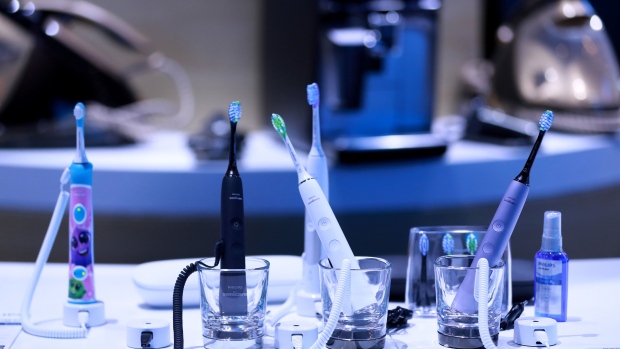 Electric toothbrushes on display on the Royal Philips NV exhibition. Photographer: Krisztian Bocsi/Bloomberg