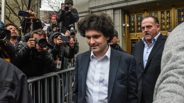 Sam Bankman-Fried, co-founder of FTX Cryptocurrency Derivatives Exchange, center, departs from court in New York, US, on Tuesday, Jan. 3, 2023. Bankman-Fried pleaded not guilty to criminal charges Tuesday and is set to face a trial in October, a courtroom showdown likely to be one of the highest-profile white-collar fraud cases in recent years.