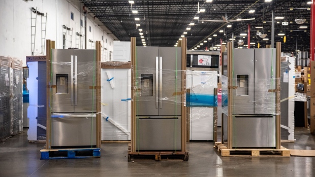 Whirlpool Corp. refrigerators sit on paletts at a distribution center in Wilmer, Texas, U.S., on Thursday, Dec. 27, 2018. J.B. Hunt Transport Services Inc. is announcing Wednesday that it has agreed to pay $100 million for a New Jersey company that delivers large items to consumers, its second purchase in the space in less than two years.