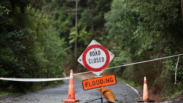 AUCKLAND, NEW ZEALAND - JANUARY 30: Konini Rd in Titirangi is closed with slips and flooding on January 30, 2023 in Auckland, New Zealand. New Zealand's largest city, Auckland, was hit with a historic amount of torrential rainfall on Friday, causing severe flooding which inundated roads and property across the city, with three people so far confirmed dead. Residents and emergency services began to take stock of the damage from the largest amount of rainfall in a day on record, and began recovery efforts over the weekend. (Photo by Fiona Goodall/Getty Images)