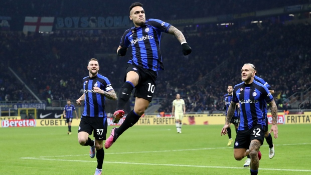 MILAN, ITALY - JANUARY 14: Lautaro Martinez of FC Internazionale celebrates after scoring the team's first goal during the Serie A match between FC Internazionale and Hellas Verona at Stadio Giuseppe Meazza on January 14, 2023 in Milan, Italy. (Photo by Marco Luzzani/Getty Images)