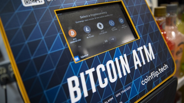 Cryptocurrencies listed on a Bitcoin automated teller machine (ATM) at a liquor store in Washington, DC, US, on Thursday, Jan. 19, 2023. Bitcoin steadied after snapping a rare 14-day winning streak as a mood of caution supplanted the risk appetite that drove up a variety of assets at the start of the year.