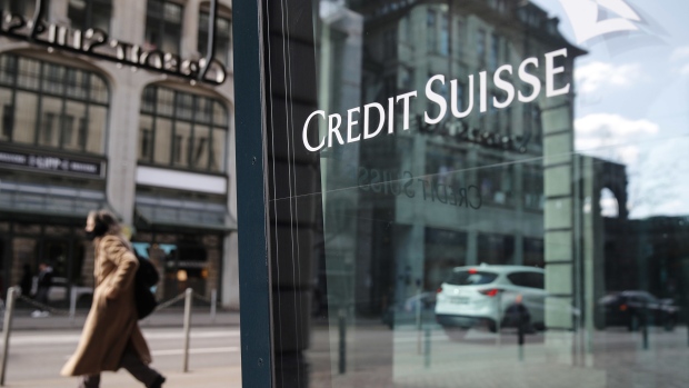 A Credit Suisse logo in a window of the Credit Suisse Group AG headquarters in Zurich, Switzerland, on Thursday, April 8, 2021. Credit Suisse Chief Executive Officer Thomas Gottstein gathered dozens of managing directors at the global bank on a conference call late Tuesday, as part of crisis-management efforts after the lender announced that it stands to lose as much as $4.7 billion amid the meltdown of hedge fund Archegos Capital Management.