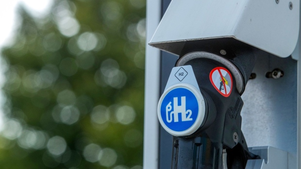 A H2 logo on the pump of a hydrogen refueling point at a Royal Dutch Shell Plc gas station in Berlin, Germany, on Wednesday, Aug. 25, 2021. Hydrogen remains a marginal part of Shell's energy mix, but the company expects to expand the business as part of its strategy to achieve net-zero emissions by 2050.