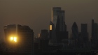 The sun reflects off skyscrapers in London. Photographer: Simon Dawson/Bloomberg
