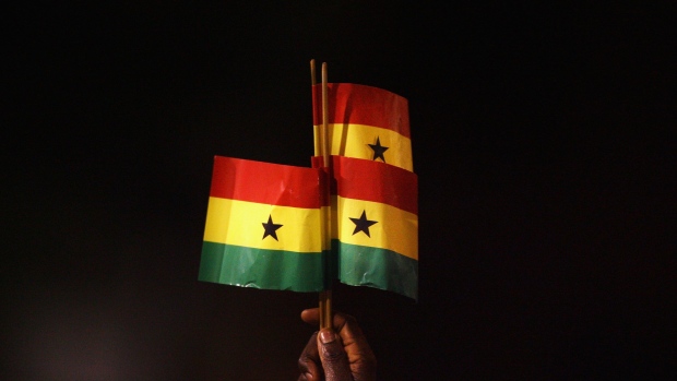 LONDON - MARCH 26: A Ghana fan holds up Ghanaian flags during the international friendly match between Ghana and Mexico at Craven Cottage on March 26, 2008 in London, England. (Photo by Ryan Pierse/Getty Images)