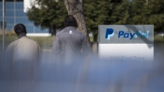 Pedestrians walk past PayPal Holdings Inc. signage outside the company's headquarters in San Jose, California, U.S., on Tuesday, Jan. 24, 2017. PayPal Holdings Inc. is scheduled to release earnings figures on January 26.